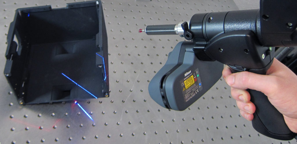 Photograph of a Nikon 3D scanner being used to measure the geometry of a plastic part
